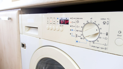 Closeup photo of washing machine digital display show that laundry is finished