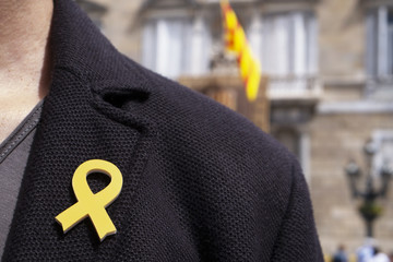man with a yellow ribbon in Barcelona, Spain