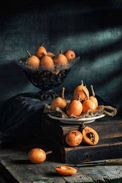 Still life with loquats on wooden rustic table