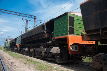 Fototapeta na wymiar Electric truck transports ore in a quarry
