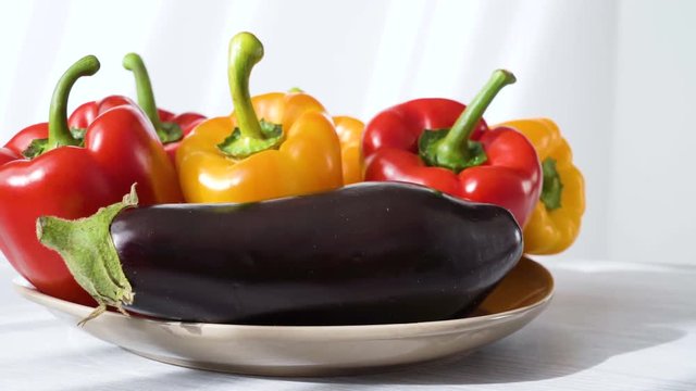 Colored red yellow Bell Pepper Placed on plate. white shaddow background. Healthy eating and lifestyle