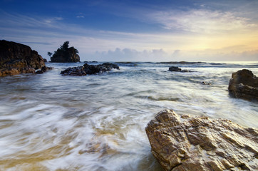Travel and leisure concept, beautiful sea view scenery over stunning sunrise background.sunlight beam and soft wave hitting sandy beach