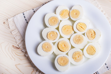 boiled eggs cut in half, lie on a plate