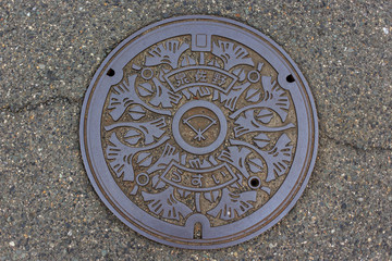 Manhole cover with unique design from Kumatori, Japan