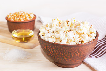 popcorn in a dark mask on background ingredients for cooking