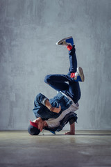 Young beautiful male dancer posing in studio