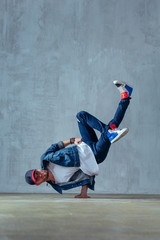 Young beautiful male dancer posing in studio