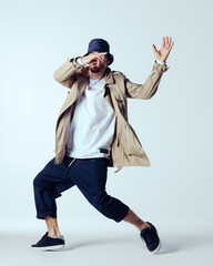 Young beautiful male dancer posing in studio