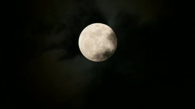 Super full moon rising and cloud moving.