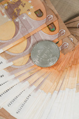 Bitcoin on banknotes of 50 euros.