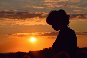 Young woman in sunset light, success, happiness, fitness concept