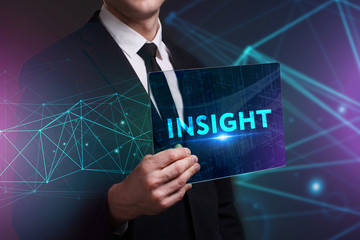 Business, Technology, Internet and network concept. Young businessman working on a virtual screen of the future and sees the inscription: Insight