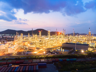 Naklejka premium Aerial view of steel pipe oil refinery plant, power plant at sunset sky for industry concept.