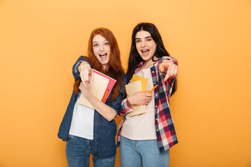Portrait of two happy young school teenage girls