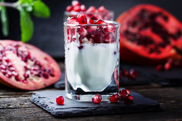 Pomegranate seeds on yogurt, Squirts milk