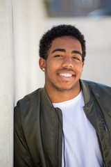 African American teenage boy smiling.