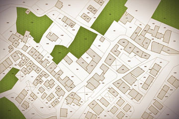 Imaginary cadastral map of territory with buildings, roads, land parcel and free green land available for building construction. Concept image - obrazy, fototapety, plakaty