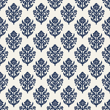 Indigo dye woodblock printed seamless ethnic floral all over pattern. Traditional oriental ornament of India, lily flowers of Kashmir, navy blue on ecru background. Textile design.