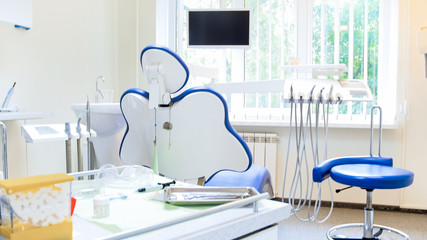 Interior of modern dental clinic with professional equipment