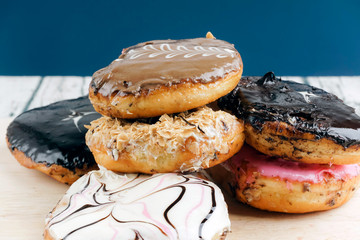 Messy setup of variety of donuts.
