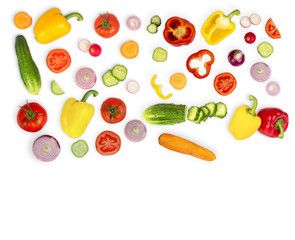 Vegetable mix on white isolated background. Fresh yellow pepper, chopped tomatoes, onion, round cucumber slice, carrot, radish. The concept of a healthy lifestyle. Vegetarian food.