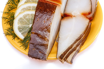 Smoking halibut fish with lemon and dill
