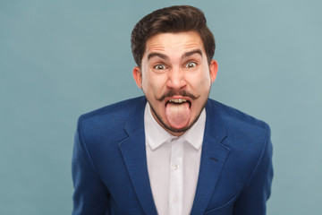 Portrait of man with big eyes, tongue out and shout