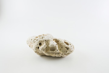 Boulder shape with a surface of national erosion on a white back