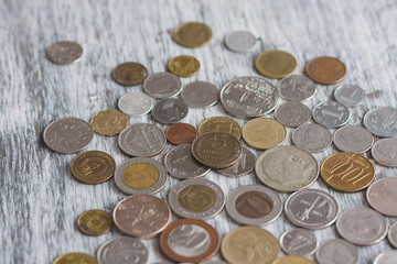 Different collector coins on the wooden background