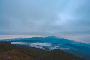 Obraz na płótnie Canvas high mountains peaks range clouds in fog scenery landscape national park view outdoor at Chiang Rai, Chiang Mai Province, Thailand