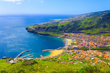 Madeira island from the air, Machico bay, travel beautiful places in Portugal islands