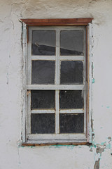 white and brown painted old house window