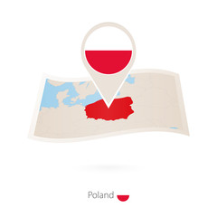 Fototapeta premium Folded paper map of Poland with flag pin of Poland.