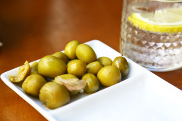 Drink and olives in a spanish bar