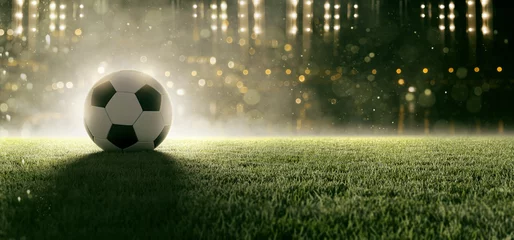 Abwaschbare Fototapete Fußball Fußball liegt auf Stadionrasen im Rauch