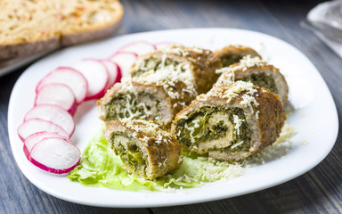 pork roulades stuffed with spinach sprinkled with freshly grated horseradish