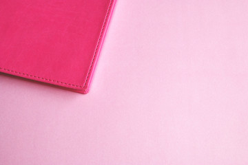 Fototapeta premium pink notebook on a pink background