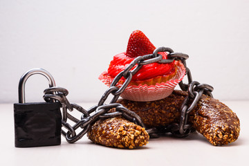 Cake with chain and padlock, diet concept.