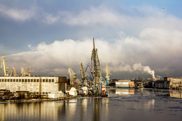 Fototapeta na wymiar Cranes in the marine cargo port of Saint-Petersburg