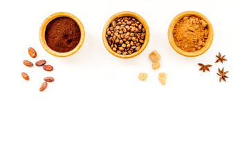 Flavouring products for making desserts. Cinnamon, cocoa, coffee on white table top view space for text
