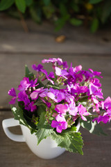bouquet of small purple flowers on a wooden background