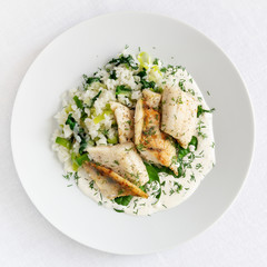 fish chops with white rice and greens served with sauce