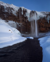 Frozen Seljalandsfoss waterfall in winter in south Iceland