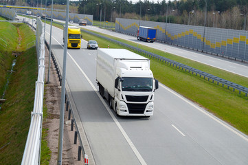 Traffic. Acoustic wall that protects residents against noise generated by passing trucks and cars.