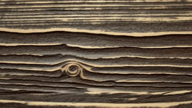 A sliding footage of a beautiful wooden surface texture. May be used for background.