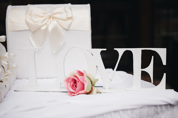 Table for giving newlyweds. Wedding candy boxes, white. Gifts to guests. Wedding decor, style, selective focus.