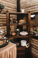 Wedding decor. Wedding interior. Festive decor. Table decor. Table with sweets and treats for guests. Candy bar Rustik. Selection focus