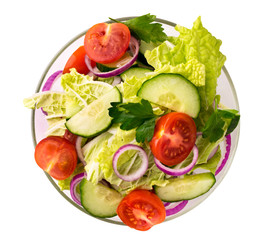Vegetable salad in glass plate on a white isolated. The view from the top.