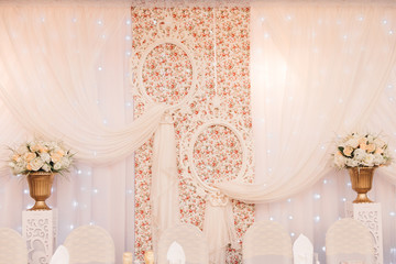 Wedding decor of the Presidium of the bride and groom table. Wedding in white provance, selective focus