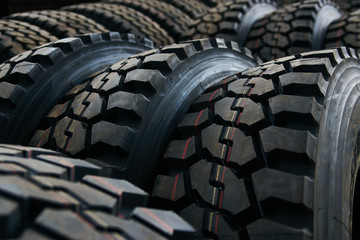 Car tires texrture background, close-up. New black tire texture
